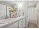 Double vanity bathroom with marble countertop and shower/tub combo at 415 Splash Pointe, Temple, GA 30179