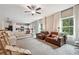Spacious living room with comfortable seating and large windows at 415 Splash Pointe, Temple, GA 30179