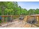 Relaxing deck overlooking wooded backyard at 415 Splash Pointe, Temple, GA 30179