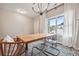 Bright dining area with large window and wood table at 415 Splash Pointe, Temple, GA 30179