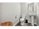 Clean and modern bathroom with pedestal sink and toilet at 415 Splash Pointe, Temple, GA 30179