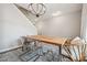 Dining area with a wood table and modern chandelier at 415 Splash Pointe, Temple, GA 30179