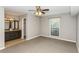 Main bedroom with ceiling fan, large window and bathroom access at 801 River Mill Cir, Roswell, GA 30075