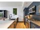 Modern kitchen with blue cabinets, stainless steel appliances, and quartz countertops at 790 North Ne Ave # 204, Atlanta, GA 30306