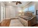 Cozy bedroom with hardwood floors, daybed, and plantation shutters at 3125 Carlton Rd, Cumming, GA 30041