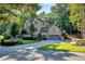 Brick two-story home with a two-car garage and landscaped yard at 3125 Carlton Rd, Cumming, GA 30041