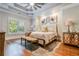 Spacious main bedroom with tray ceiling, plush carpet, and natural light at 3125 Carlton Rd, Cumming, GA 30041