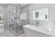Luxurious bathroom with a large walk-in shower and soaking tub at 1985 Saint Johns Sw Pl, Atlanta, GA 30315