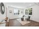 Bright living room features hardwood floors, natural light, and comfortable seating at 1985 Saint Johns Sw Pl, Atlanta, GA 30315