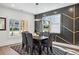 Bright dining room with a dark wood table and six chairs at 1985 Saint Johns Sw Pl, Atlanta, GA 30315