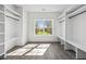 Bright walk-in closet with built-in shelving and natural light at 1985 Saint Johns Sw Pl, Atlanta, GA 30315