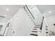 Elegant staircase with dark wood accents and white railings at 1985 Saint Johns Sw Pl, Atlanta, GA 30315