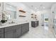 Modern bathroom with gray cabinets and marble-look tile floors at 1985 Saint Johns Sw Pl, Atlanta, GA 30315