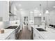 Sleek white kitchen with stainless steel appliances and an island at 1985 Saint Johns Sw Pl, Atlanta, GA 30315