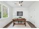 Well-lit home office with hardwood floors and built-in desk at 1985 Saint Johns Sw Pl, Atlanta, GA 30315