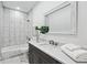 Modern bathroom boasts marble tile, quartz countertop, and spacious vanity at 1985 Saint Johns Sw Pl, Atlanta, GA 30315