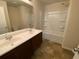 Bathroom with double sinks and a shower/tub at 2546 Piering Dr, Lithonia, GA 30038