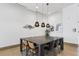 Modern dining area with a large table and stylish chairs at 788 West Marietta St # 1604, Atlanta, GA 30318