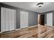 Bedroom with gray walls, hardwood floors and double closets at 6945 Butner Rd, Atlanta, GA 30349