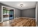 Spacious bedroom with gray walls, hardwood floors and access to deck at 6945 Butner Rd, Atlanta, GA 30349