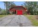 House exterior with a red door and attached garage at 6945 Butner Rd, Atlanta, GA 30349
