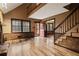 Spacious living room with hardwood floors, fireplace and stairs at 6945 Butner Rd, Atlanta, GA 30349