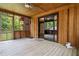 Screened porch with wood flooring and access to backyard at 6945 Butner Rd, Atlanta, GA 30349