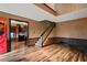 Bright entryway with red door, hardwood floors, and view of kitchen at 6945 Butner Rd, Atlanta, GA 30349