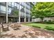 Courtyard with seating area and lush green space at 2575 Peachtree Ne Rd # 14A, Atlanta, GA 30305