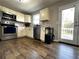 Kitchen with stainless steel appliances and wood-look floors at 28 Fawn Ct, Sharpsburg, GA 30277