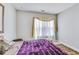 Cozy bedroom featuring a window with sheer curtains at 2172 Haventree Ct, Lawrenceville, GA 30043