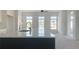 Open concept kitchen and living room with an island and large windows at 6000 Stallion Rdg, Douglasville, GA 30135