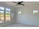 Bright bedroom with large windows and ceiling fan at 6000 Stallion Rdg, Douglasville, GA 30135