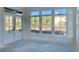 Bright sunroom with French doors and large windows offering scenic views at 6000 Stallion Rdg, Douglasville, GA 30135