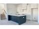 Modern kitchen with white cabinets and a large dark island at 6000 Stallion Rdg, Douglasville, GA 30135