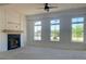 Bright living room with large windows, fireplace, and high ceilings at 6000 Stallion Rdg, Douglasville, GA 30135