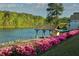 Scenic lakefront property with gazebo and lush landscaping at 6000 Stallion Rdg, Douglasville, GA 30135