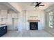 Spacious living room with a fireplace, large windows, and high ceilings at 6000 Stallion Rdg, Douglasville, GA 30135