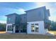 Modern home exterior with pergola and large windows at 6000 Stallion Rdg, Douglasville, GA 30135