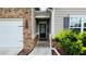 Inviting front entry with brick walkway and landscaping at 2209 Cedar Place Ct, Snellville, GA 30078