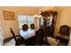 Formal dining room with large china cabinet and hardwood floors at 2209 Cedar Place Ct, Snellville, GA 30078