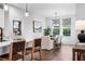 Dining area with table for six and large windows at 1732 Juniper Berry Way, Loganville, GA 30052