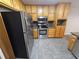 Kitchen with stainless steel appliances and wood cabinets at 215 Moseley Crossing Dr, Stockbridge, GA 30281