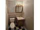 Basement bathroom with checkerboard floor and vanity at 215 Moseley Crossing Dr, Stockbridge, GA 30281