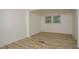 Bright bedroom with wood-look floors and large window at 2437 Clarissa Dr, Atlanta, GA 30318