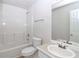 Clean bathroom with single vanity, shower/tub combo, and updated fixtures at 80 Stewart Hollow Ln, Covington, GA 30016
