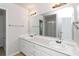 Double vanity bathroom with updated fixtures and neutral tones at 80 Stewart Hollow Ln, Covington, GA 30016