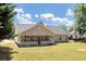 Spacious backyard with a large grassy area and home at 80 Stewart Hollow Ln, Covington, GA 30016