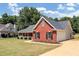 Red brick home with attached garage and driveway at 80 Stewart Hollow Ln, Covington, GA 30016