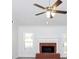 Living room with fireplace, vaulted ceiling and fan at 80 Stewart Hollow Ln, Covington, GA 30016